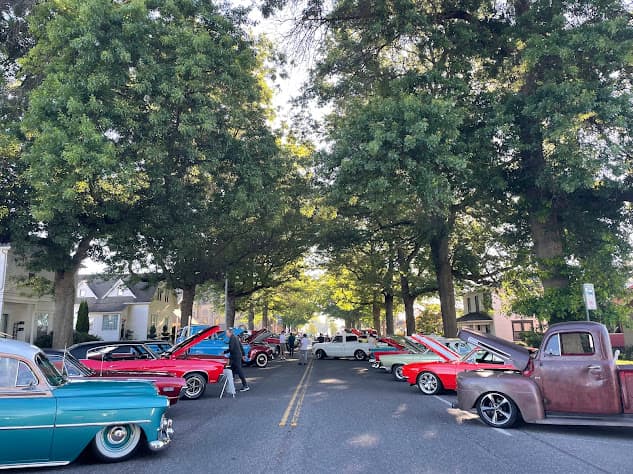 fancy cars parked along front street