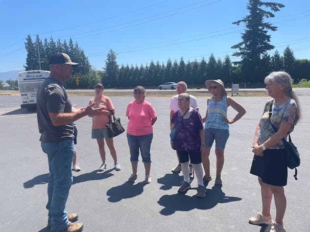 a tour guide giving a tour at a raspberry farm